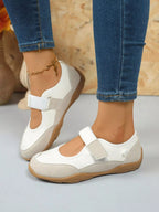 Women's faux leather and suede round toe loafers with Velcro strap, stylish and comfortable shoe by Trendsi.