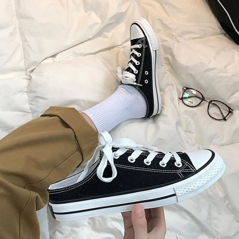 Women's round toe lace-up canvas sneakers by Trendsi, lightweight casual flat shoes with a classic design and comfortable fit.