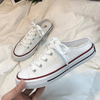 Women's round toe lace-up canvas sneakers by Trendsi, lightweight casual flat shoes with a classic design and comfortable fit.