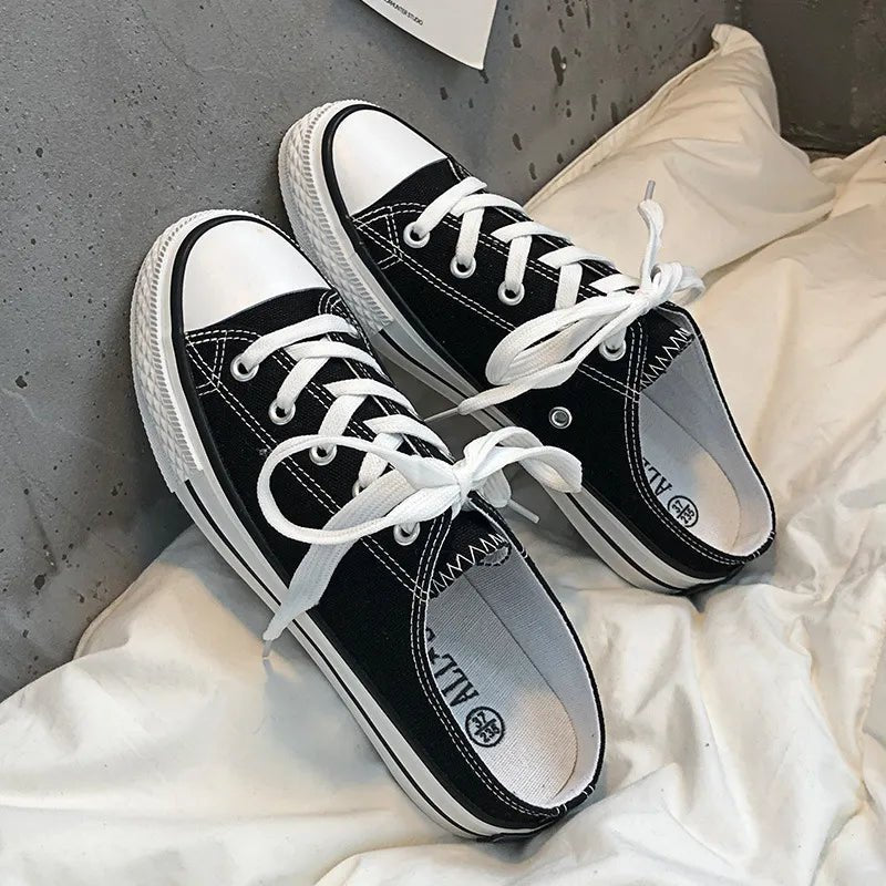 Women's round toe lace-up canvas sneakers by Trendsi, lightweight casual flat shoes with a classic design and comfortable fit.