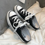 Women's round toe lace-up canvas sneakers by Trendsi, lightweight casual flat shoes with a classic design and comfortable fit.
