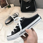 Women's round toe lace-up canvas sneakers by Trendsi, lightweight casual flat shoes with a classic design and comfortable fit.