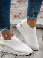 Women's round toe wedge sneakers by Trendsi with breathable fabric and stylish comfort, shown in a side view.