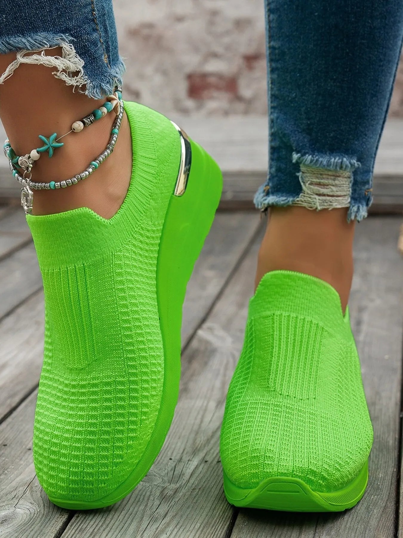 Women's round toe wedge sneakers by Trendsi featuring breathable material and stylish comfort for casual fashion footwear.