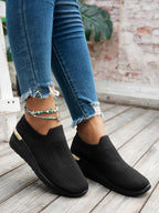 Women's round toe wedge sneakers by Trendsi, featuring breathable fabric and stylish design for comfortable fashion footwear.