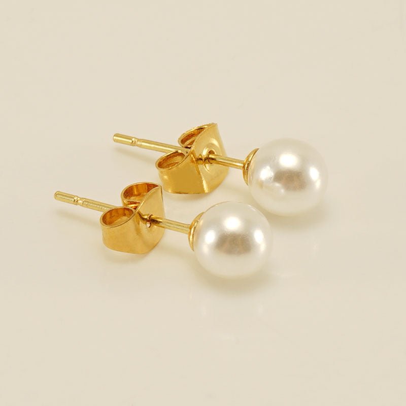 Sterling silver freshwater pearl ear studs with needle design, featuring elegant natural pearls, from Plush Fashion Hub.