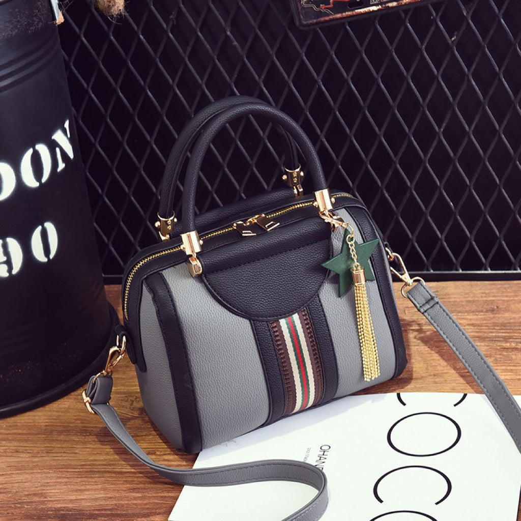 Plush Fashion Hub Sally shoulder bag in black with gold hardware, featuring a sleek design and adjustable strap.