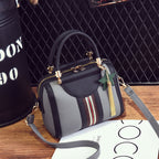 Plush Fashion Hub Sally shoulder bag in black with gold hardware, featuring a sleek design and adjustable strap.