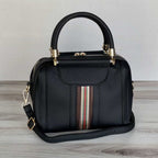 Plush Fashion Hub Sally shoulder bag with a sleek design, top handle, and adjustable strap, made of smooth leather.
