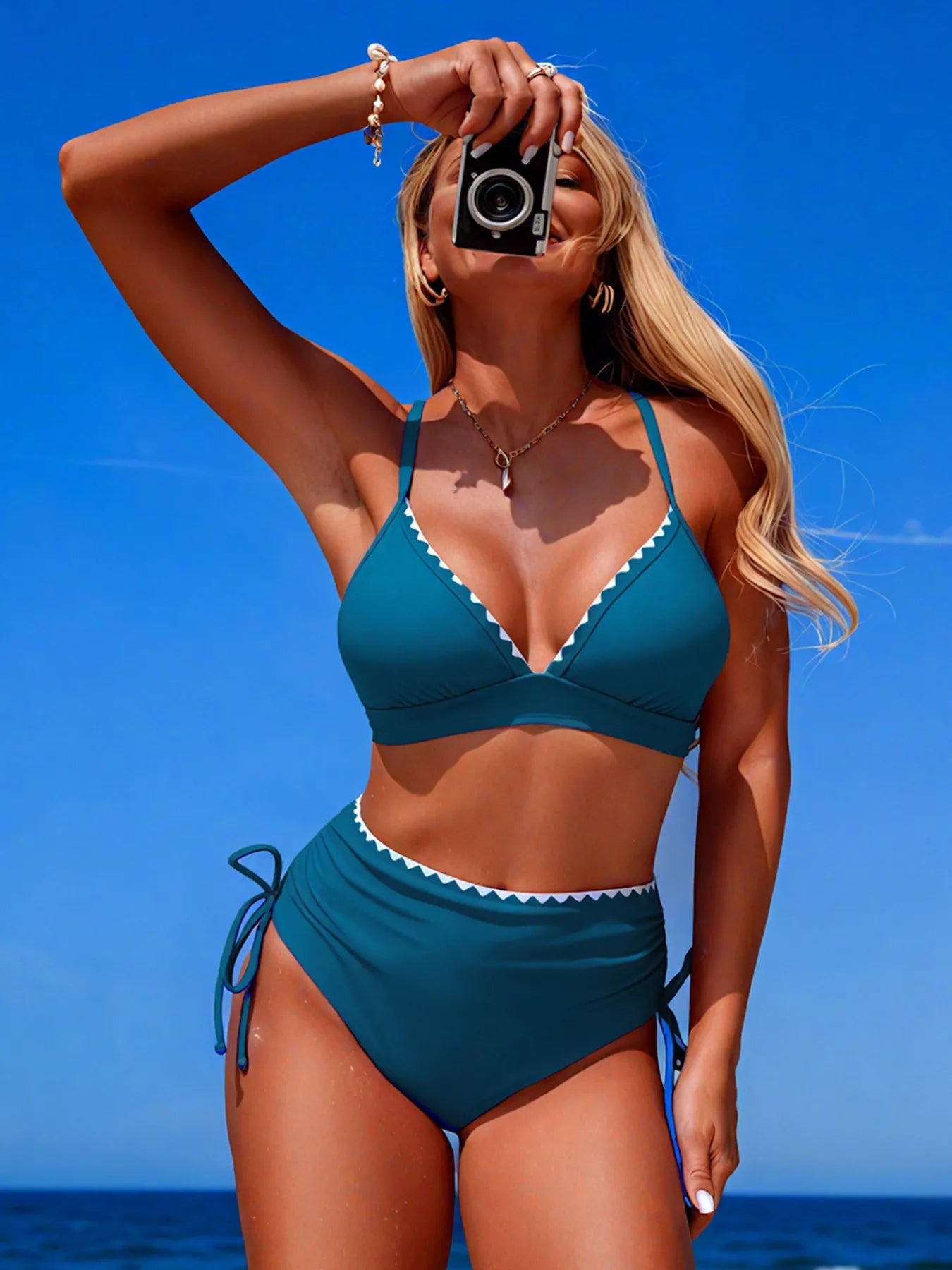 Stylish two-piece high-waisted bikini set with scalloped trim, trendy swimwear design, perfect for beach or poolside wear.