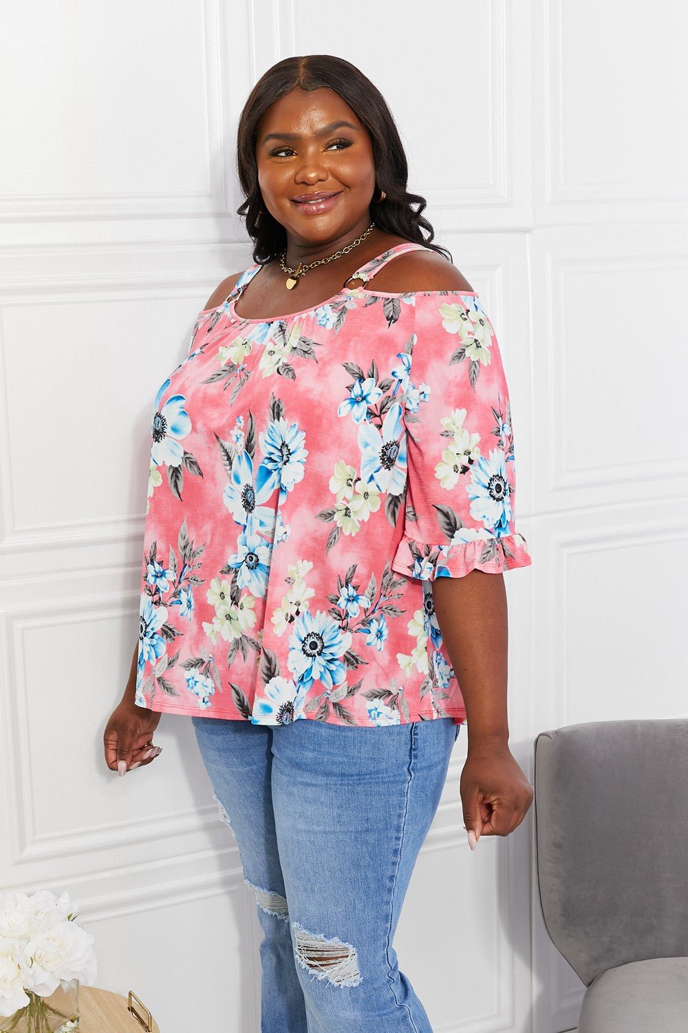 Floral cold-shoulder three-quarter sleeve top for women with metal ring details, stylish and trendy fashion from Trendsi.