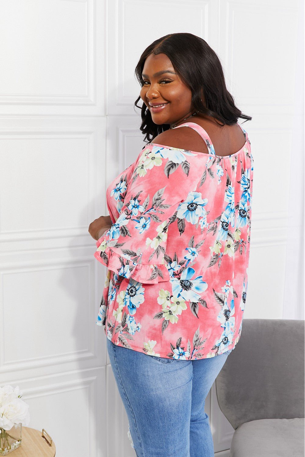 Floral cold-shoulder women’s top with three-quarter sleeves and metal ring details, stylish trendy fashion from Trendsi.