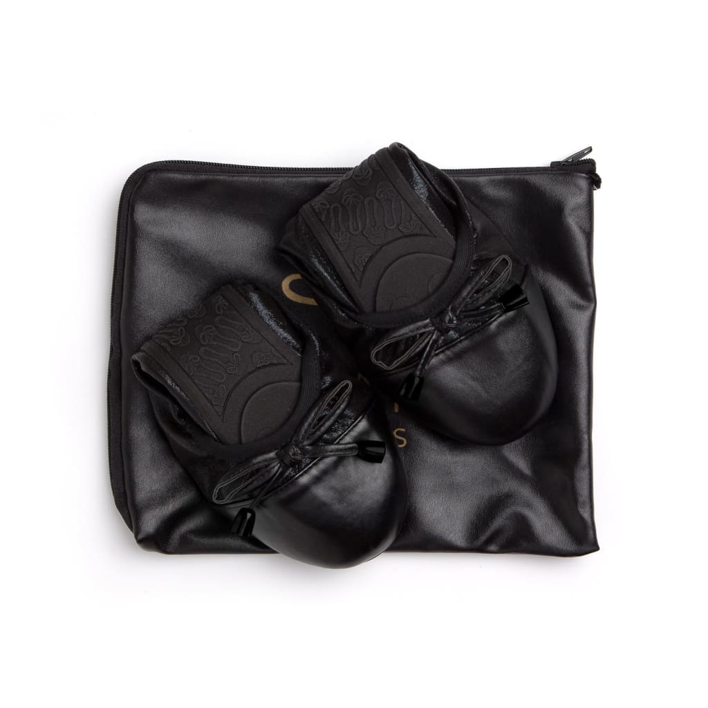 Black flats shoes by Plush Fashion Hub featuring a sleek design and comfortable slip-on style.