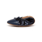 Pair of Talaria Flats in navy blue leather, stylish and comfortable slip-on footwear for women.