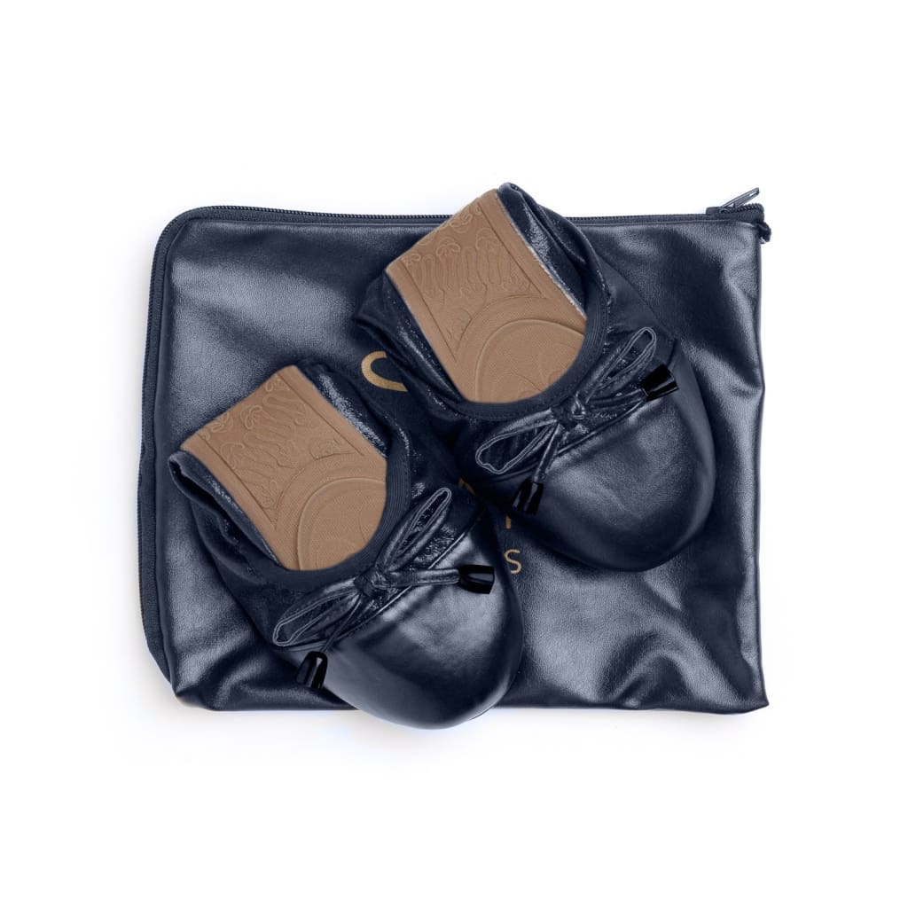 Pair of Talaria Flats navy blue casual footwear for women, showing the comfortable slip-on design and sleek leather material.