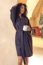 Knee-length waffle robe for women from Plush Fashion Hub, soft and cozy with a textured waffle fabric and long sleeves.