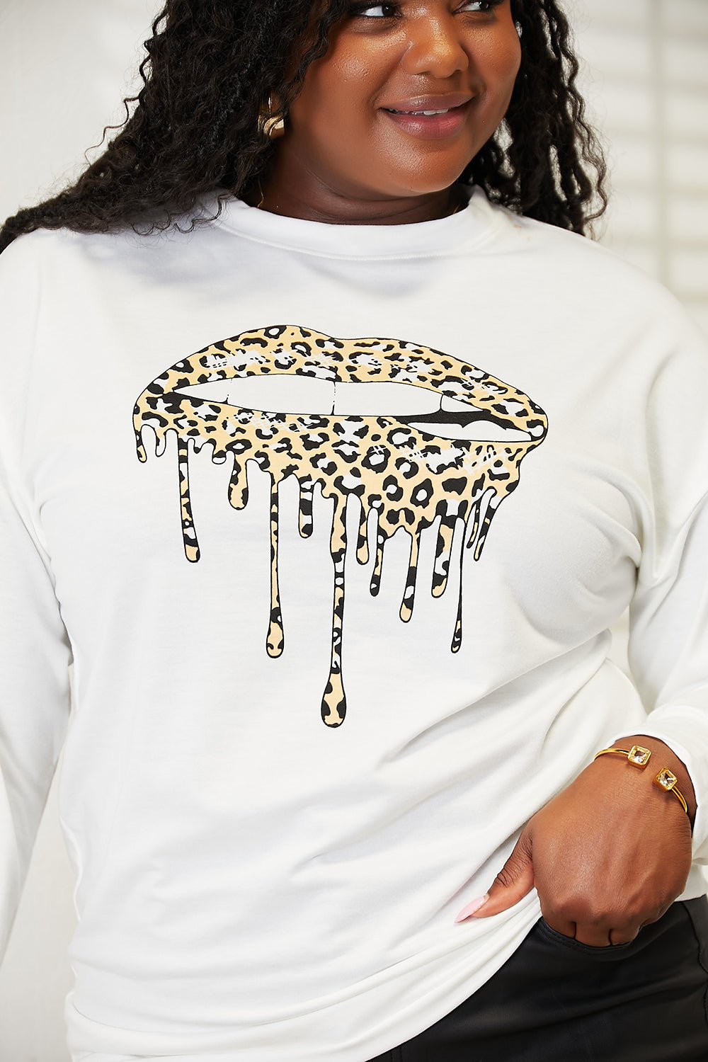 Women's Simply Love graphic print dropped shoulder sweatshirt with round neckline, casual women’s apparel by Trendsi.