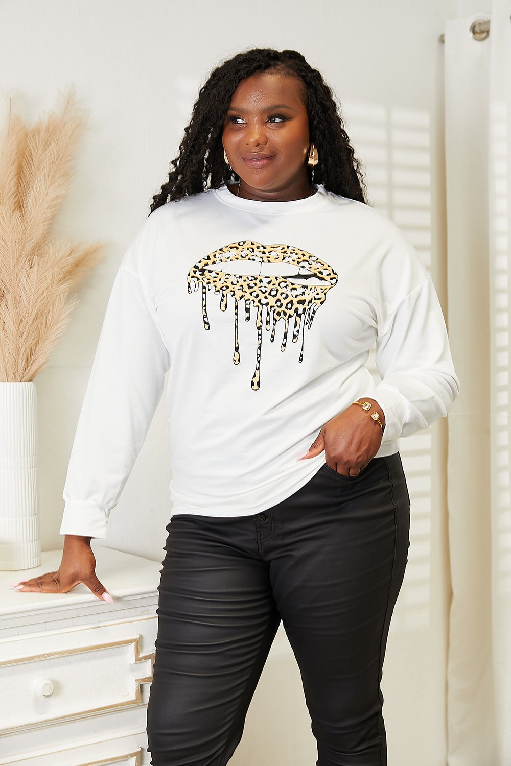 Women's Simply Love graphic print dropped shoulder sweatshirt from Trendsi, featuring a round neck and casual style.