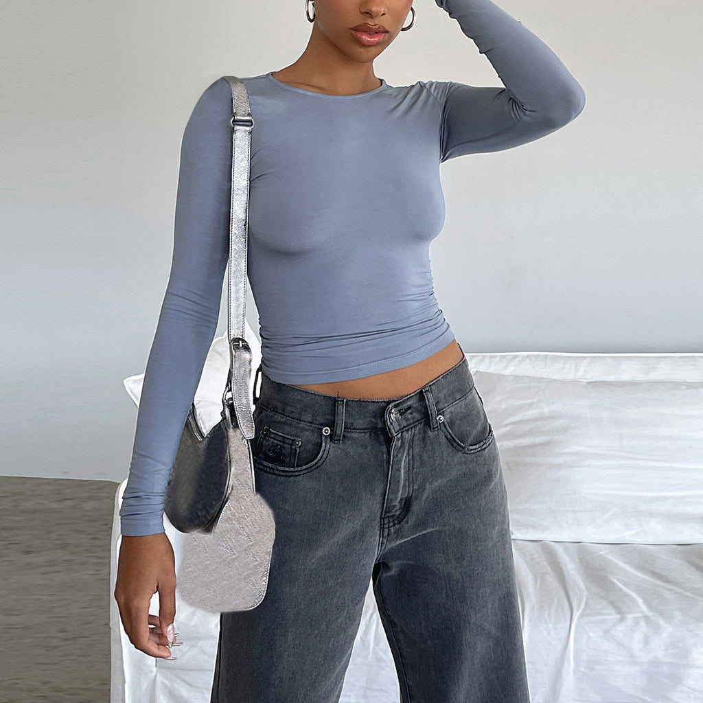 Slim fit women's long sleeve casual shirt from Plush Fashion Hub, styled as a trendy crop top with a sleek fit.
