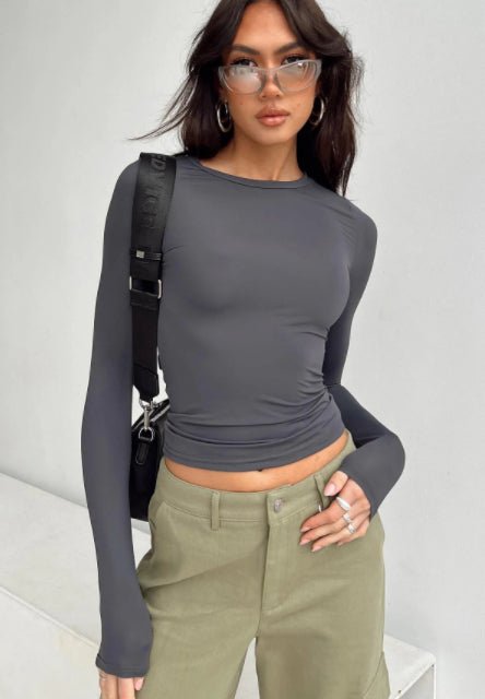 Slim fit women's long sleeve casual shirt from Plush Fashion Hub, styled as a trendy crop top with a modern fit.