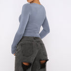 Slim fit women's long sleeve casual crop top by Plush Fashion Hub, shown in a relaxed, stylish fit on a model.
