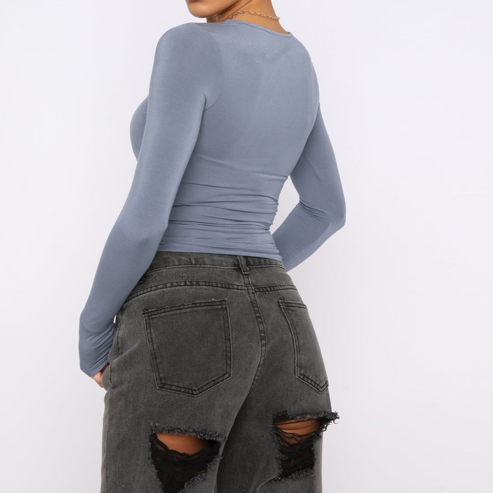 Slim fit women's long sleeve casual crop top by Plush Fashion Hub, shown in a relaxed, stylish fit on a model.