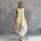 Solid-color sleeveless loose-fit dress with patch pockets, casualwear by Plush Fashion Hub, shown in a neutral fabric and relaxed fit.