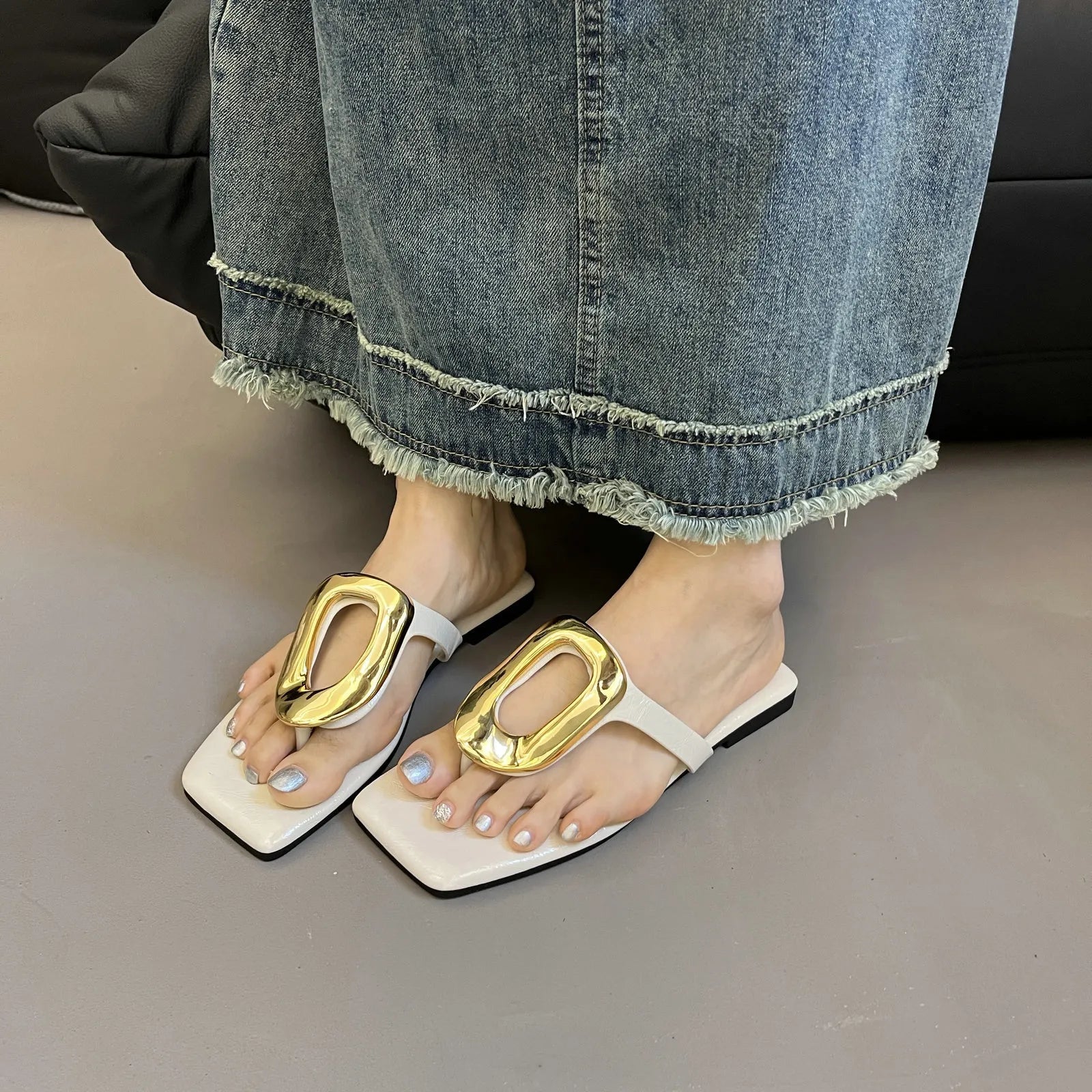 Women's square toe flat sandals with metallic detail by Trendsi, featuring a chic design and comfortable slip-on style.