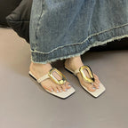 Women's chic square toe flat sandals with metallic detail by Trendsi, featuring stylish design and comfortable flat sole.
