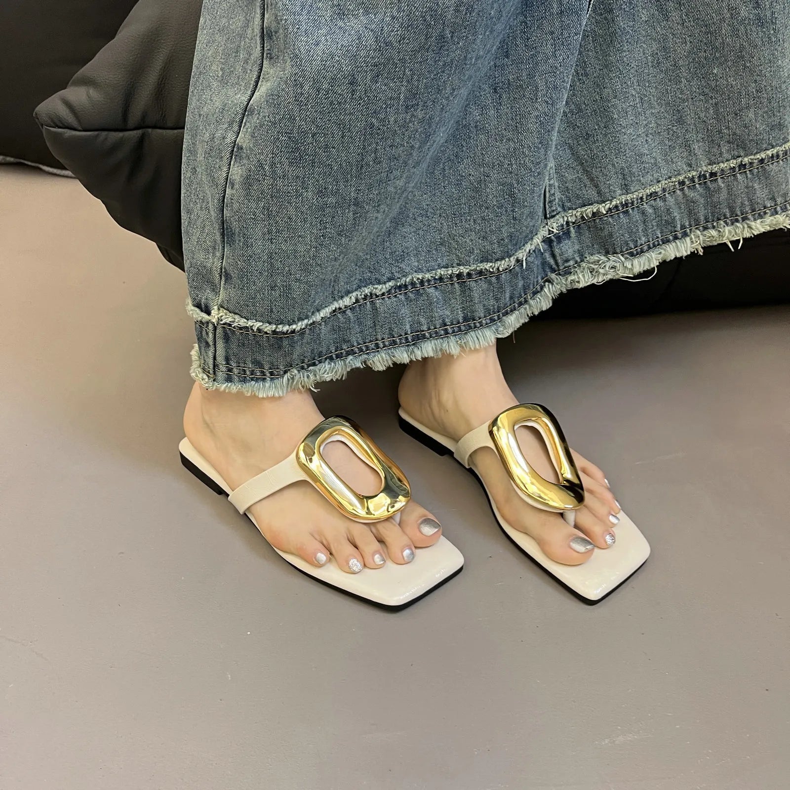 Women's chic square toe flat sandals with metallic detail by Trendsi, featuring stylish design and comfortable flat sole.