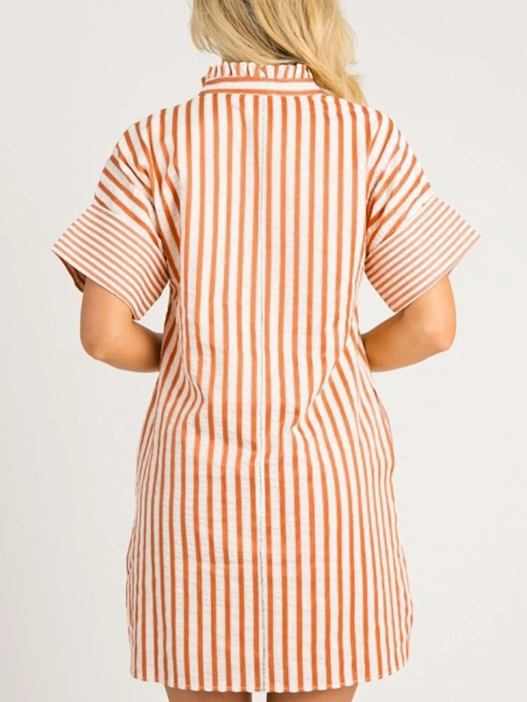 Stripe pinched V-neck mini dress with turn-up cuffs and pockets, by Plush Fashion Hub, shown hanging on a mannequin.