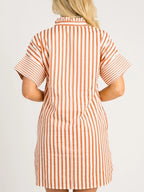 Stripe pinched V-neck mini dress with turn-up cuffs and pockets, by Plush Fashion Hub, shown hanging on a mannequin.