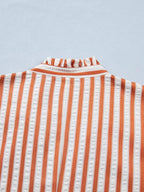 Plush Fashion Hub stripe pinched V-neck mini dress with turn-up cuffs and pockets, stylish and fitted for a casual look.