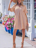 Stripe Pinched V-Neck Mini Dress by Plush Fashion Hub featuring turn-up cuffs and functional pockets, perfect for casual or chic looks.