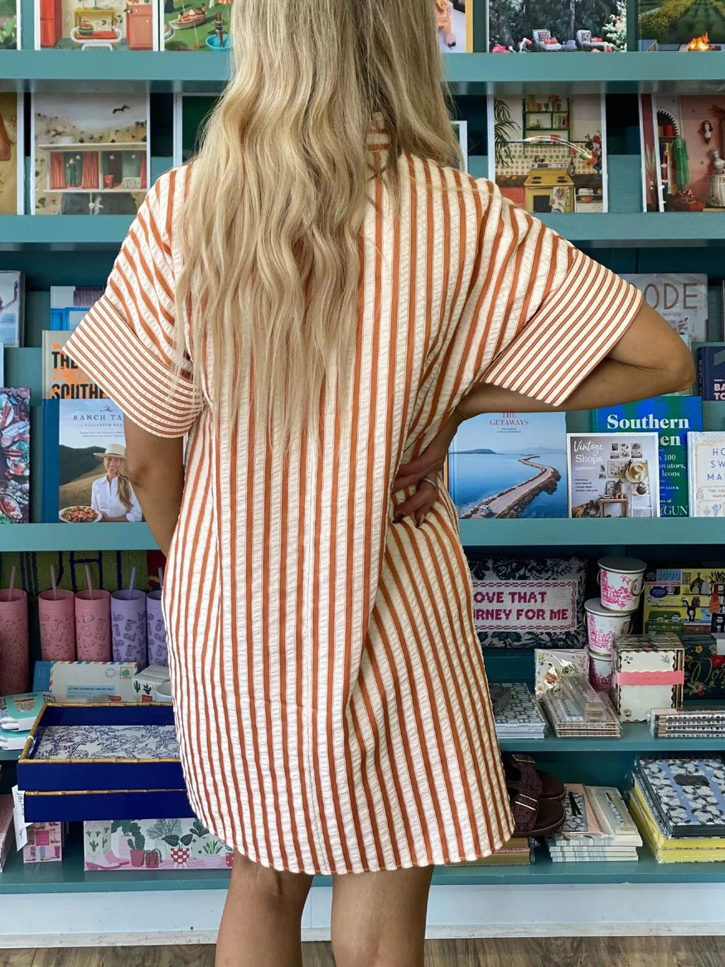 Stripe pinched V-neck mini dress with turn-up cuffs and pockets from Plush Fashion Hub, shown on a model.