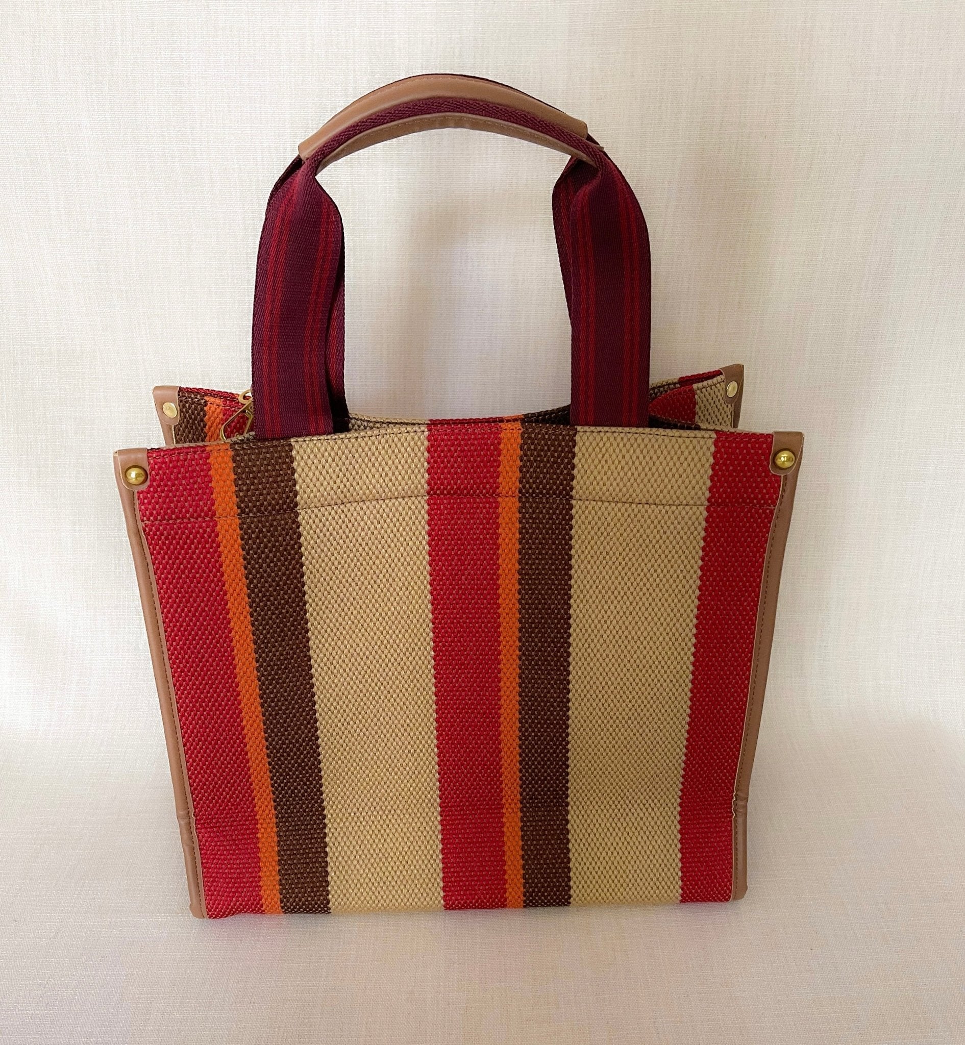 Plush Fashion Hub Stripe Tote bag with bold striped design, sturdy handles, and spacious interior for everyday use.