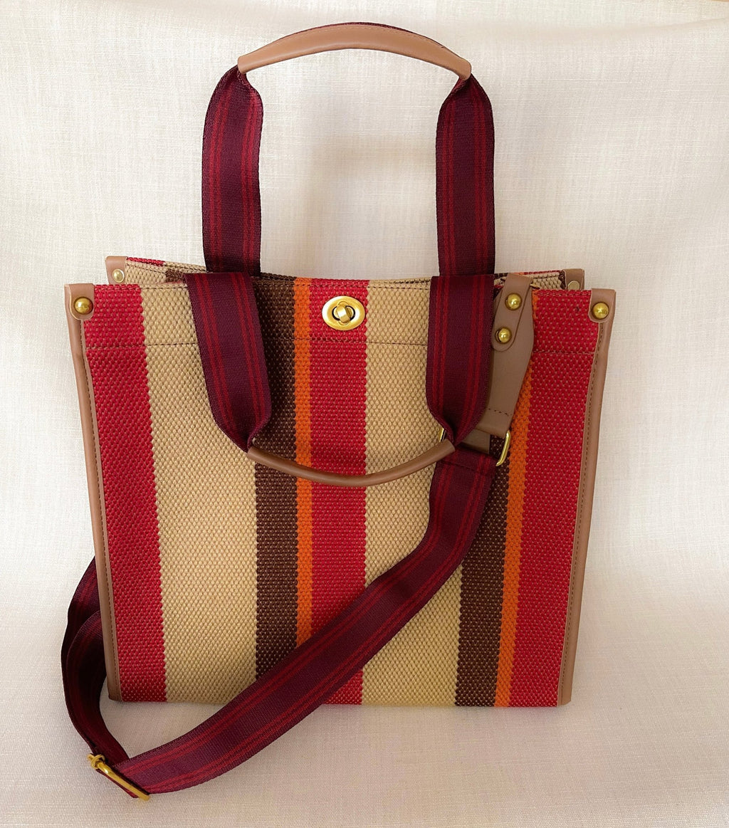 Plush Fashion Hub Stripe Tote bag with bold striped pattern and sturdy handles, perfect for everyday use.