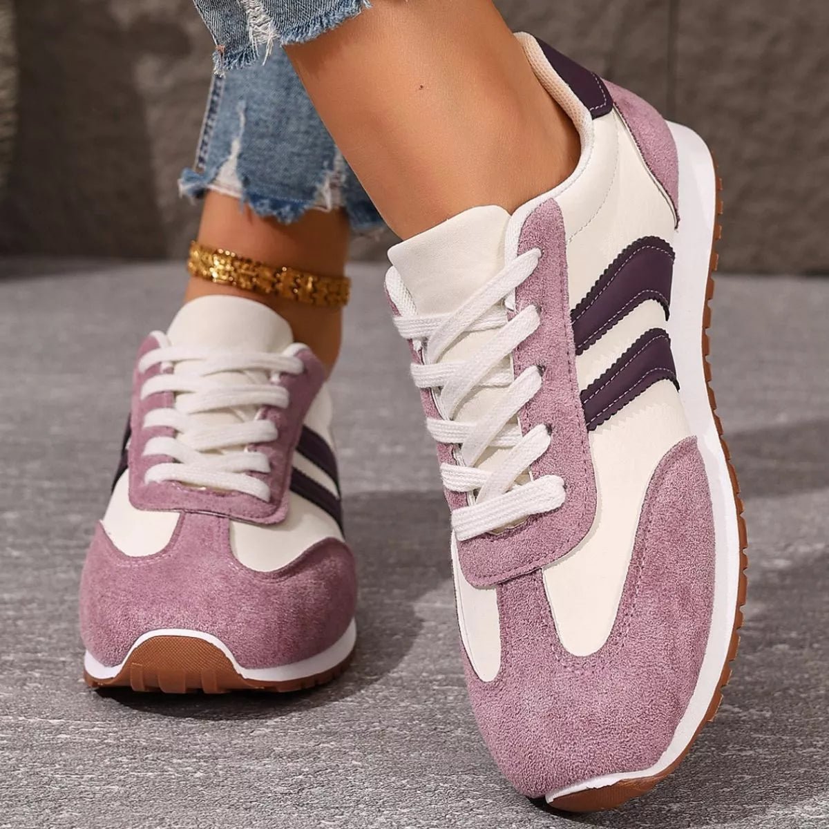 Women's casual suede striped lace-up sneakers by Trendsi, featuring comfortable design and stylish striped pattern.