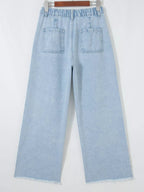Trendsi studded wide leg jeans with frayed hem and side slits, featuring metal stud accents and relaxed fit.