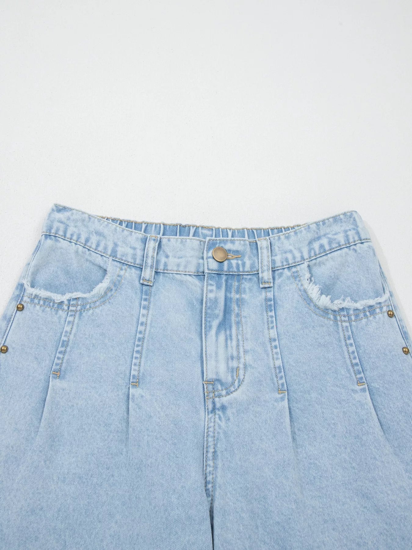 Trendsi studded wide leg jeans with frayed hem and side slits, showcasing distressed denim and fashionable design details.