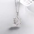 Silver snowflake necklace with diamond pendant, stylish jewelry piece showcasing a delicate winter-inspired design.