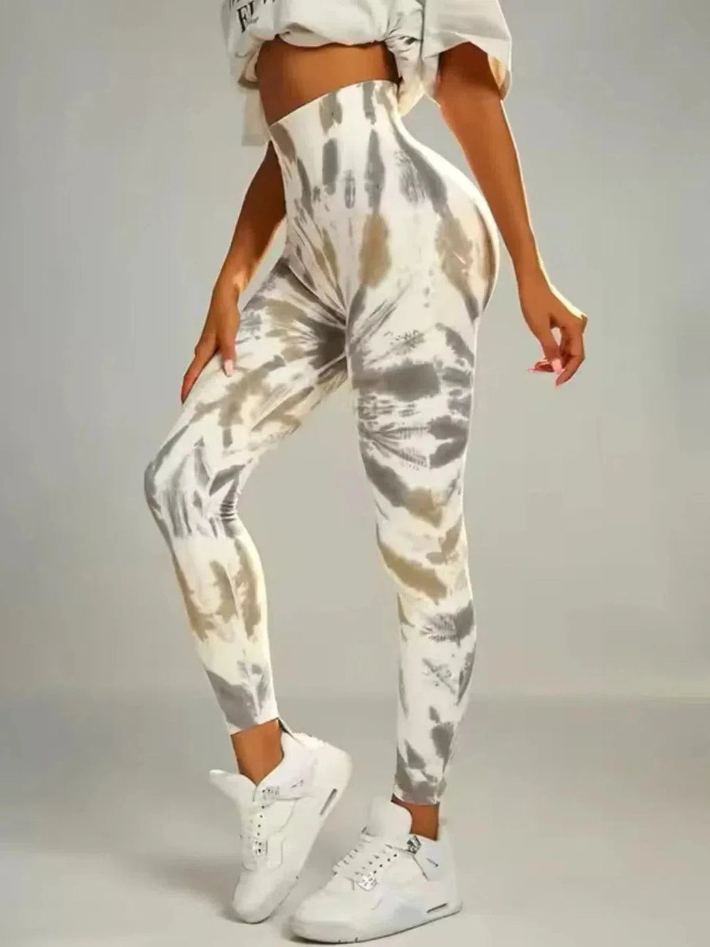 Tie-dye seamless high-waist leggings from FitiqueFit with scrunch butt design, perfect for casualwear and activewear.