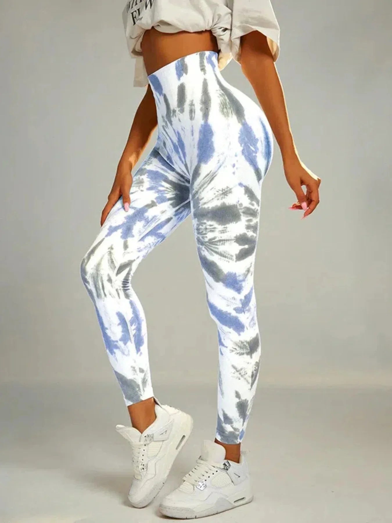 Colorful tie-dye seamless high-waist leggings from FitiqueFit with scrunch butt design, ideal for casualwear and activewear.