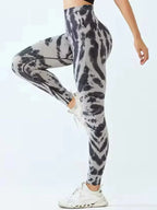 Tie-dye seamless high-waist leggings with scrunch butt design by FitiqueFit, featuring vibrant colors and a comfortable fit.