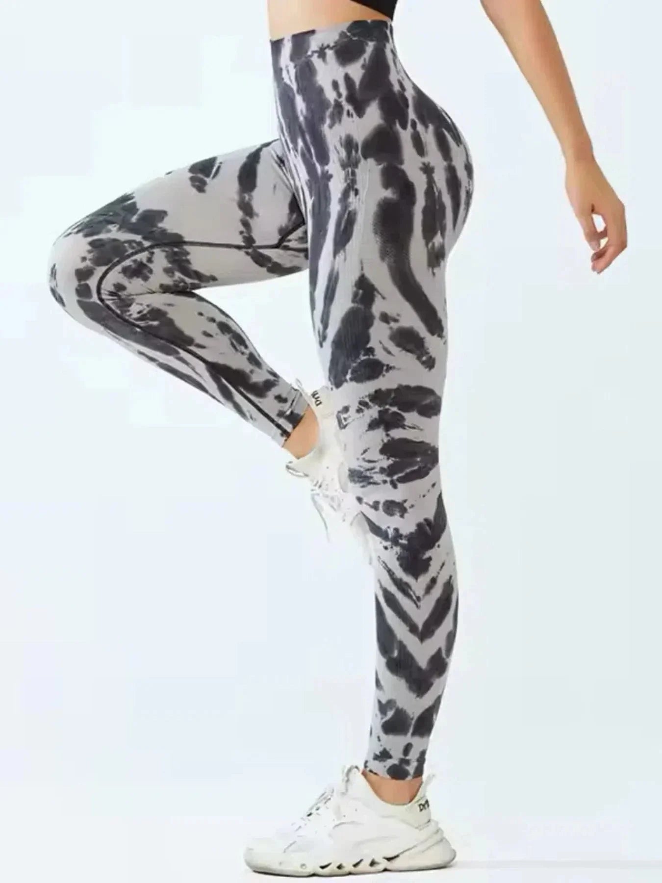 Tie-dye seamless high-waist leggings with scrunch butt design by FitiqueFit, featuring vibrant colors and a comfortable fit.
