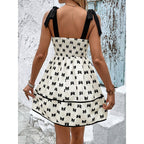 Plush Fashion Hub tie-strap mini dress with smocked bodice and A-line silhouette, perfect for casual summer wear.