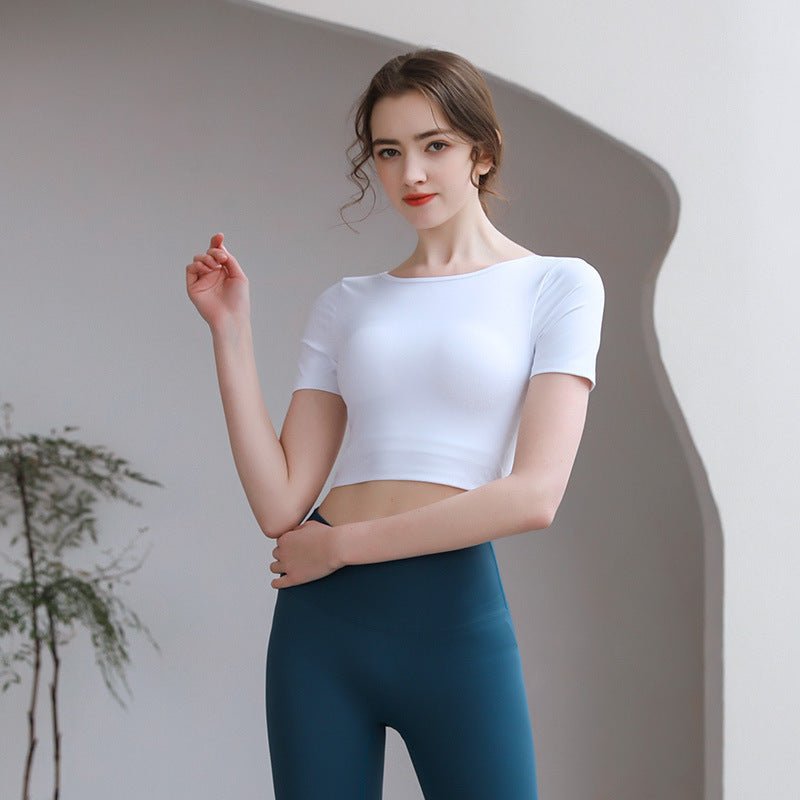 Plush Fashion Hub tight-fit yoga top with chest pad, breathable fabric, and stylish back design for activewear workouts.