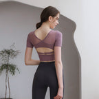 Plush Fashion Hub tight-fit yoga top with chest pad, breathable fabric, and stylish back design for activewear workouts.