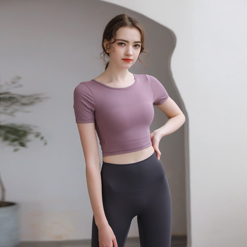 Plush Fashion Hub tight-fit yoga top with chest pad, breathable fabric, and stylish back design for activewear performance.