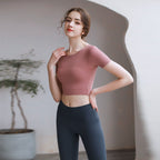 Plush Fashion Hub tight fit yoga top with chest pad, breathable fabric, and stylish back design for activewear workouts.